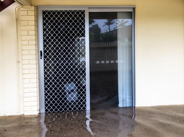 Flood waters running through a screen door
