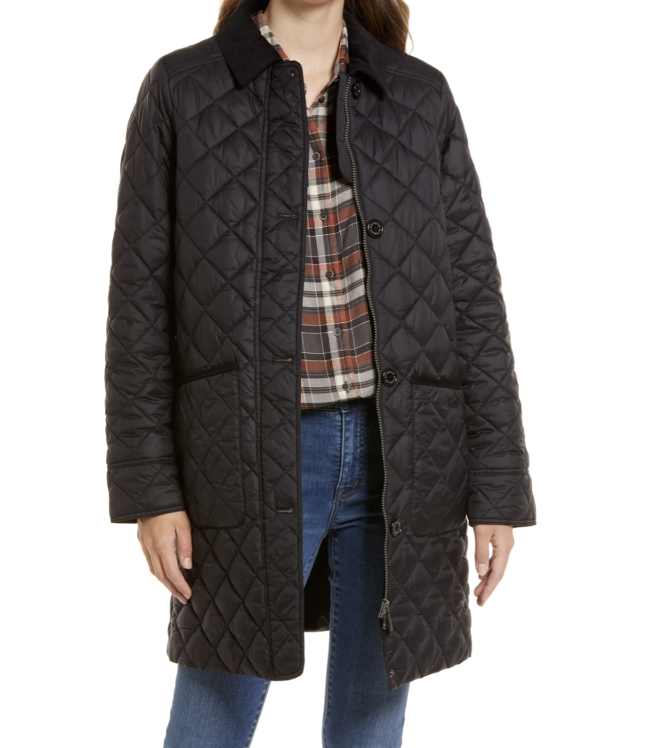 model posing in black Barbour Hollingworth Quilted Jacket wearing jean and a plaid shirt