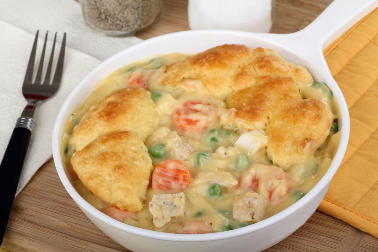 Chicken pot pie meal with carrots and peas