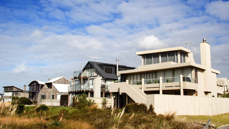 modern beach homes on a sunny day.