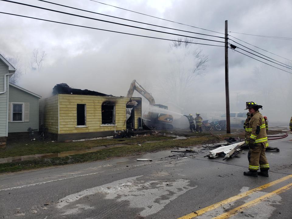 Firefighters respond to a house fire in the 8900 block of Avoca Road on Friday, April 1, 2022.