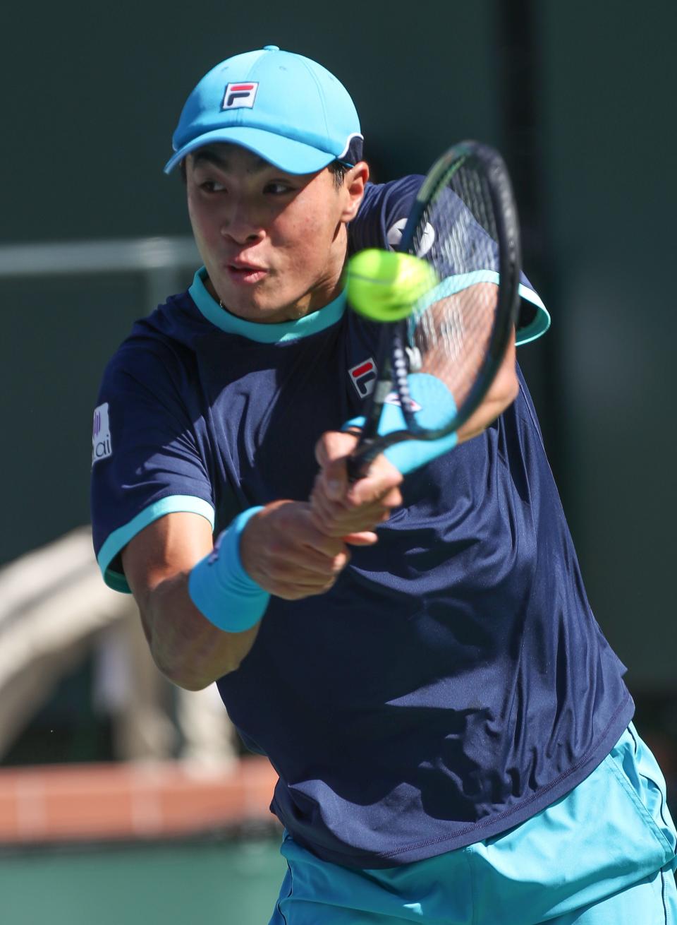Brandon Nakashima hits a shot in his match against John Isner during the BNP Paribas Open in Indian Wells, Calif., March 8, 2023. 