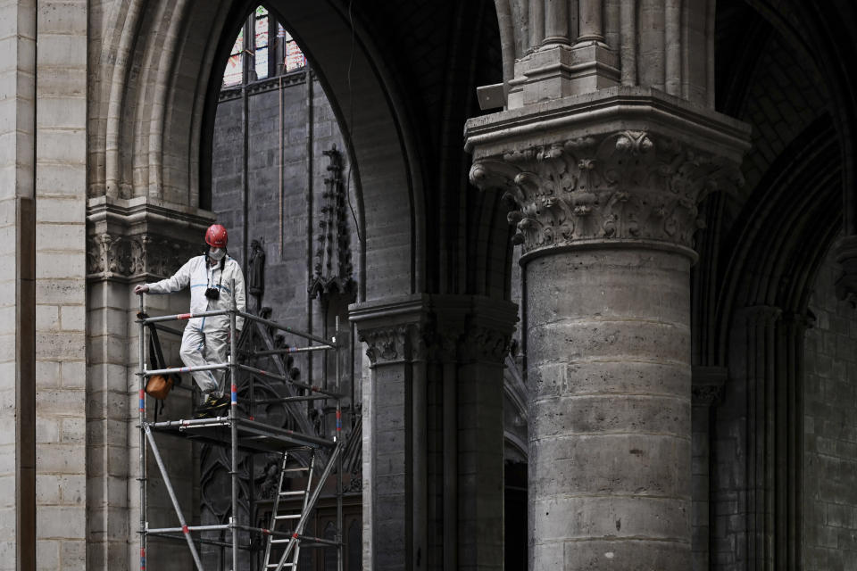 A worker stands on scaffolding during preliminary work inside the Notre Dame de Paris Cathedral, May 15, 2019 in Paris. (Photo: Philippe Lopez/Pool via AP)          