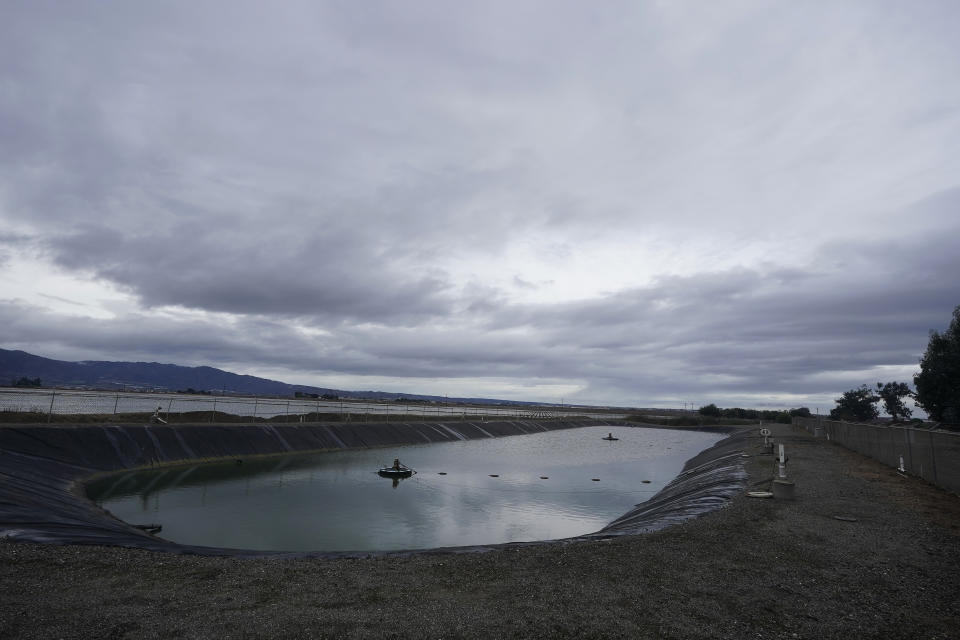 Part of the San Jerardo cooperative community sewer system holds water in Salinas, Calif., Wednesday, Dec. 20, 2023. Some California farming communities have been plagued for years by problems with their drinking water due to nitrates and other contaminants in the groundwater that feeds their wells. (AP Photo/Jeff Chiu)