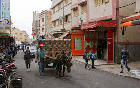 A man rides a horse cart in Ouled Moussa district, on the outskirts of Rabat, Morocco April 24, 2018. REUTERS/Youssef Boudlal