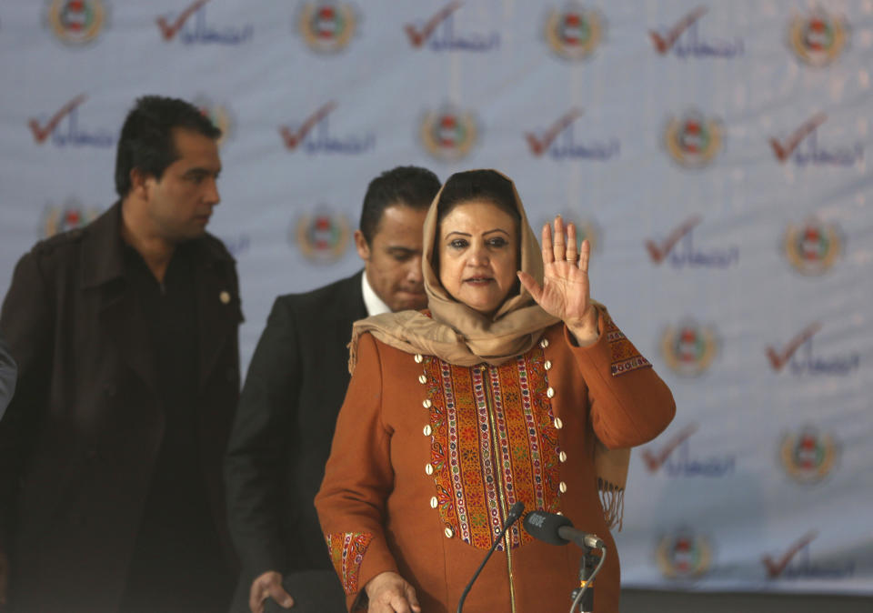 Hawa Alam Nuristani, chief of Election Commission of Afghanistan, arrives for a press conference at the Independent Election Commission office in Kabul, Afghanistan, Sunday, Dec. 22, 2019. The election commission is to announce the results of the Sept. 28 election Sunday. (AP Photo/Rahmat Gul)