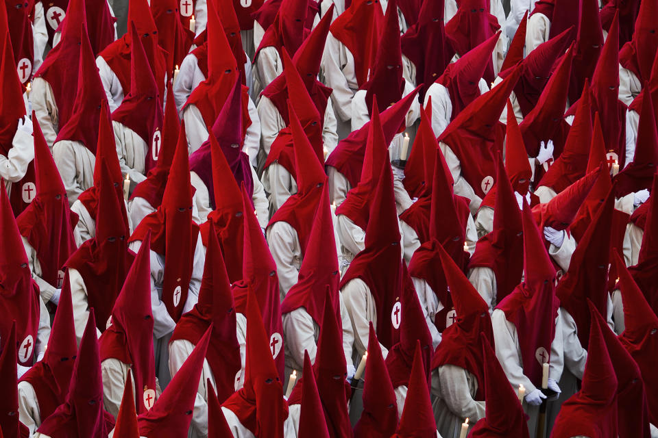 <p>Penitents take part in the “Procesión del Silencio” by the Cristo de las Injurias brotherhood during Easter Holy Week in Zamora, Spain, April 16, 2014. (AP Photo/Andres Kudacki) </p>