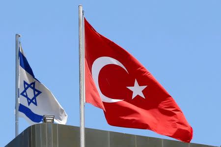 A Turkish flag flutters atop the Turkish embassy as an Israeli flag is seen nearby, in Tel Aviv, Israel June 26, 2016. Picture taken June 26, 2016. REUTERS/Baz Ratner