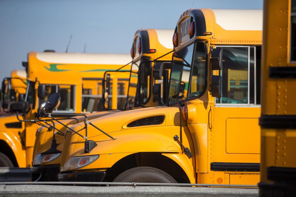 School buses are parked on Wednesday, Sept. 29, 2021, in the parking lot at the Rockford Public Schools transportation center in Rockford.