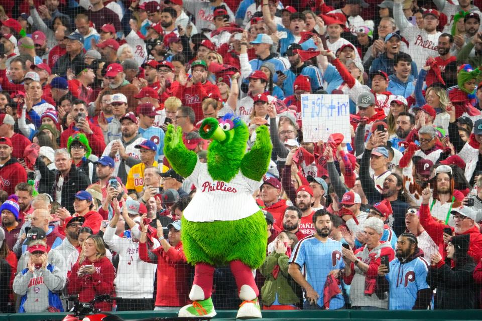 Fans hold a sign before the game between the Arizona Diamondbacks and the Philadelphia Phillies in game seven of the NLCS at Citizens Bank Park in Philadelphia on Oct. 24, 2023.