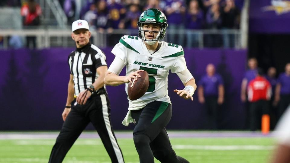 New York Jets quarterback Mike White (5) looks to pass against the Minnesota Vikings during the fourth quarter.