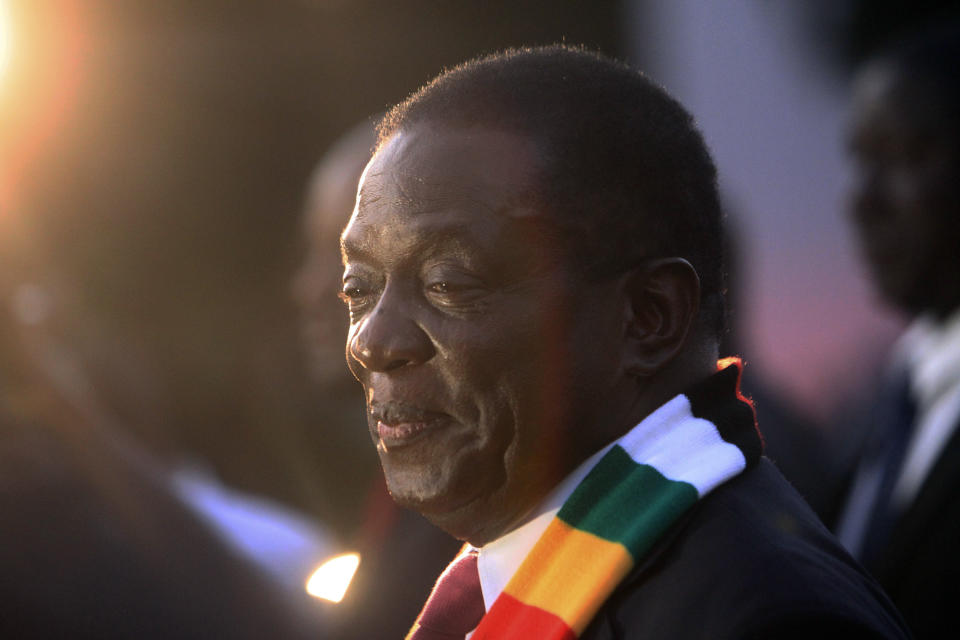 Zimbabwean President elect Emmerson Mnangagwa smiles after addressing a press conference in Harare ,Friday, Aug, 3, 2018. Zimbabwe's president says people are free to approach the courts if they have issues with the results of Monday's election, which he carried with just over 50 percent of the vote. President Emmerson Mnangagwa spoke to journalists shortly after opposition leader Nelson Chamisa called the election results manipulated and said they would be challenged in court. (AP Photo/Tsvangirayi Mukwazhi)