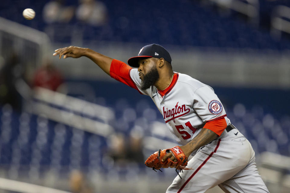 Washington Nationals relief pitcher Wander Suero (51) delivers a pitch during the ninth inning of a baseball game against the Miami Marlins on Thursday, June 24, 2021, in Miami. (AP Photo/Mary Holt)