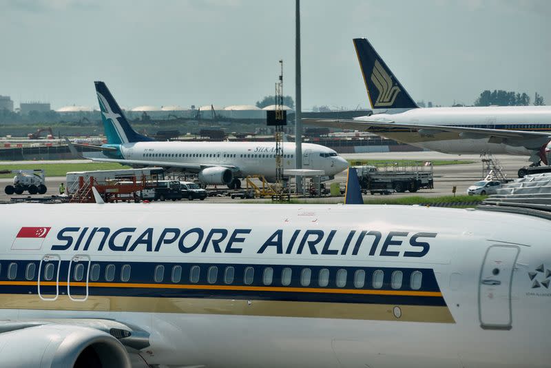 FILE PHOTO: Singapore Airlines planes sit on the tarmac at Changi Airport in Singapore