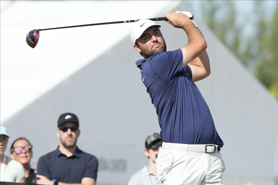 Scottie Scheffler, of the United States, watches his shot on the fourth tee during the third round of the Hero World Challenge PGA Tour at the Albany Golf Club, in New Providence, Bahamas, Saturday, Dec. 2, 2023. (AP Photo/Fernando Llano)