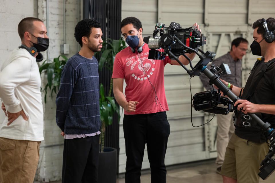 (L to R) Director of photography Doug Emmett, actor Justice Smith and writer/director Kobi Libii on the set of THE AMERICAN SOCIETY OF MAGICAL NEGROES, a Focus Features release. Credit: Tobin Yelland / Focus Features