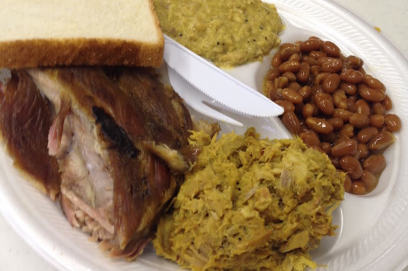 <em>The pulled pork at Cannon's BBQ in Little Mountain, SC, is dressed in an eye-catching yellow mustard sauce—and so is the hash & rice.</em>