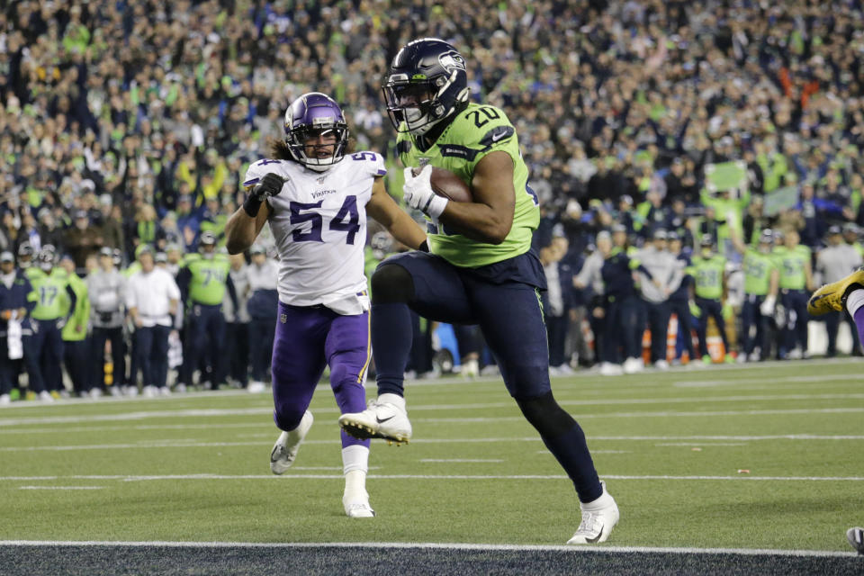 Seattle Seahawks' Rashaad Penny high steps into the end zone for a touchdown against the Minnesota Vikings during the second half of an NFL football game, Monday, Dec. 2, 2019, in Seattle. (AP Photo/John Froschauer)