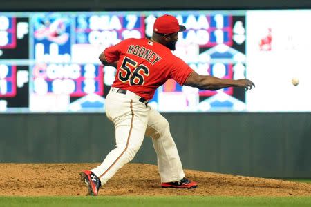Jul 13, 2018; Minneapolis, MN, USA; Minnesota Twins pitcher Fernando Rodney (56) fields the ball and throws to first base for the out to end the game against the Tampa Bay Rays at Target Field. Mandatory Credit: Marilyn Indahl-USA TODAY Sports