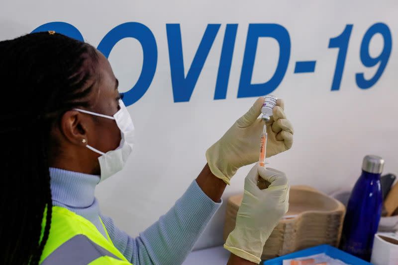 FILE PHOTO: A dose of AstraZeneca vaccine is prepared at COVID-19 vaccination centre in the Odeon Luxe Cinema in Maidstone, Britain