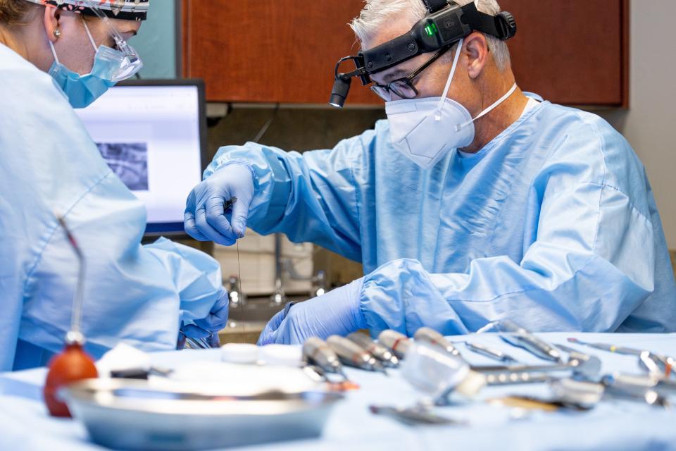 Oral and maxillofacial surgery specialist Dr. Jacob Mendenhall performs surgery on a patient in Oklahoma City.