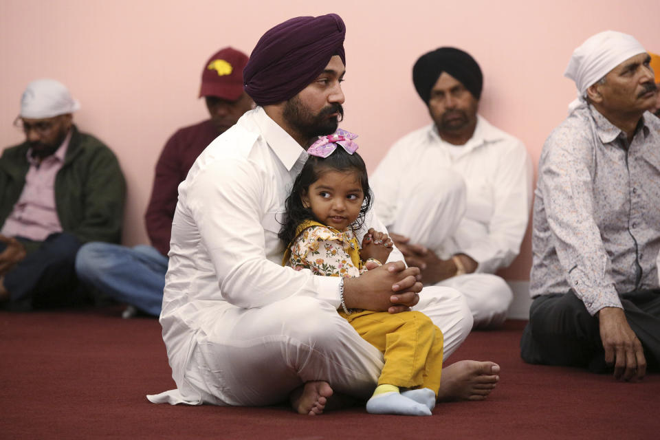 ***HOLD FOR RELIGION TEAM STORY*** Navjot Singh and Harman Kaur during the Shri Guru Ravidass Sabha ceremony at a temple in Fresno, Calif. Sunday, May 7, 2023. Members of the Ravidassia community in California are followers of Guru Ravidass, a 14th century Indian guru of a caste formerly considered untouchable. The Ravidassia community statewide is advocating for new legislation to outlaw caste-based discrimination. (AP Photo/Gary Kazanjian)