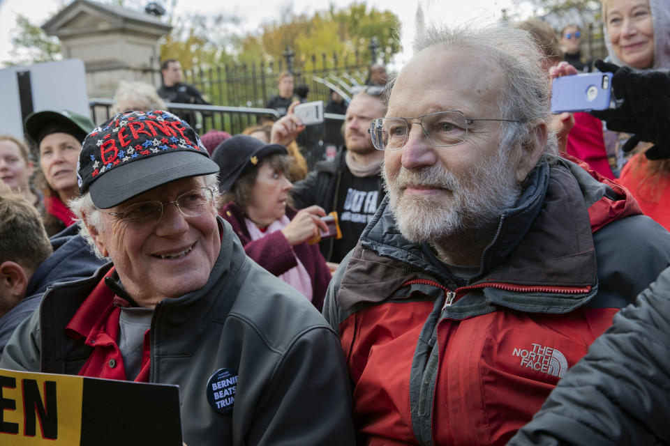 FILE - In this Nov. 8, 2019 file photo, Ben Cohen, left, and Jerry Greenfield, co-founders of Ben & Jerry's ice cream, attend a protest in Washington. The Vermont-based Ben & Jerry's has always been known for promoting social causes as much as its flavors of ice cream, but few have attracted as much attention as its decision to stop selling its ice cream in the Israeli-occupied West Bank and contested east Jerusalem. (AP Photo/Patrick Semansky, File)