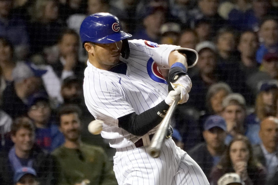 Chicago Cubs' Seiya Suzuki swings and misses on the way to striking out against Pittsburgh Pirates relief pitcher David Bednar during the seventh inning of a baseball game Thursday, April 21, 2022, in Chicago. (AP Photo/Charles Rex Arbogast)