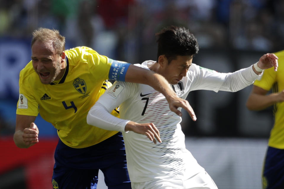 <p>Sweden’s Andreas Granqvist tussles with South Korea’s talisman Son Heung-min. (AP Photo/Petr David Josek) </p>