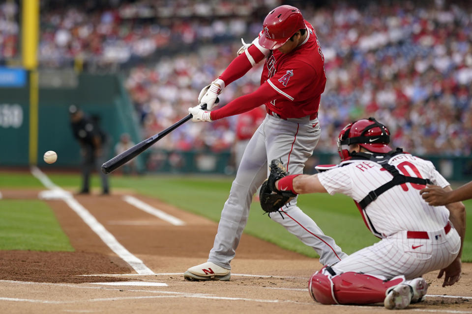 Los Angeles Angels' Shohei Ohtani hits a single against Philadelphia Phillies pitcher Taijuan Walker during the first inning of a baseball game, Monday, Aug. 28, 2023, in Philadelphia. (AP Photo/Matt Slocum)
