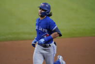 Toronto Blue Jays' Bo Bichette runs the bases after hitting a solo home run off Texas Rangers starting pitcher Dane Dunning during the first inning of a baseball game in Arlington, Texas, Tuesday, April 6, 2021. (AP Photo/Tony Gutierrez)