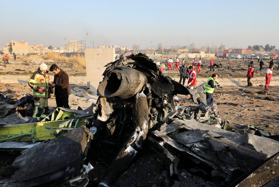 FILE - In this Wednesday, Jan. 8, 2020 file photo, debris at the scene where a Ukrainian plane crashed in Shahedshahr southwest of the capital Tehran, Iran. The crash of a Ukrainian jetliner near Tehran this week that killed all 176 on board comes as a test for Ukraine's President Volodymyr Zelenskiy, who took office less than eight months ago with no prior political experience. (AP Photo/Ebrahim Noroozi, File)