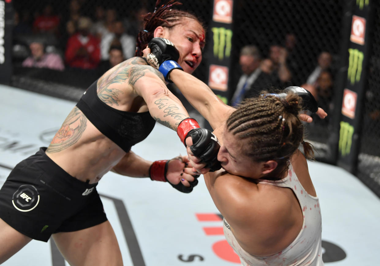 EDMONTON, ALBERTA - JULY 27:   (L-R) Cris Cyborg of Brazil punches Felicia Spencer of Canada in their featherweight bout during the UFC 240 event at Rogers Place on July 27, 2019 in Edmonton, Alberta, Canada. (Photo by Jeff Bottari/Zuffa LLC/Zuffa LLC)