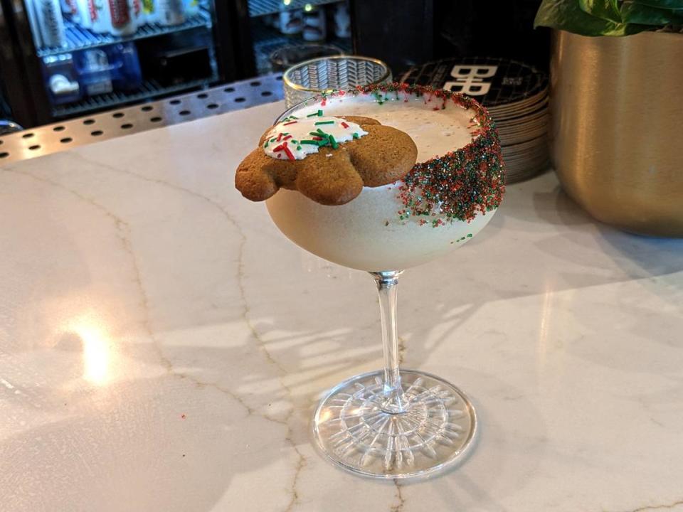 The festive Gingerbread Martini at Brick + Bramble is garnished with a gingerbread man and sprinkles.