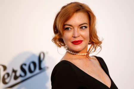 70th Cannes Film Festival – The amfAR's Cinema Against AIDS 2017 event – Photocall Arrivals - Antibes, France. 25/05/2017. Lindsay Lohan poses. REUTERS/Stephane Mahe