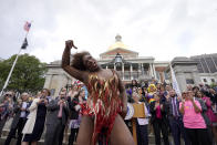 Drag performer Neon Calypso sings and dances to Tina Turner's version of the song "Proud Mary," during a Pride Month Celebration, Wednesday, June 7, 2023, in front of the Statehouse, in Boston. The event included a performance of about a dozen drag performers at a time when some states have tried to target drag performances. (AP Photo/Steven Senne)