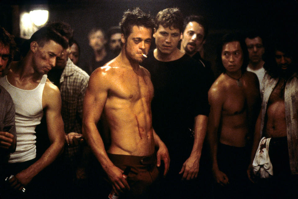 Brad Pitt stands in a fight club