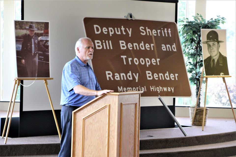 Bender family spokesman Craig Massie speaks to the crowd gathered for the roadway dedication ceremony honoring Bill Bender and Randy Bender on Friday, July 15, 2022, at the Marion County Sheriff's Office.