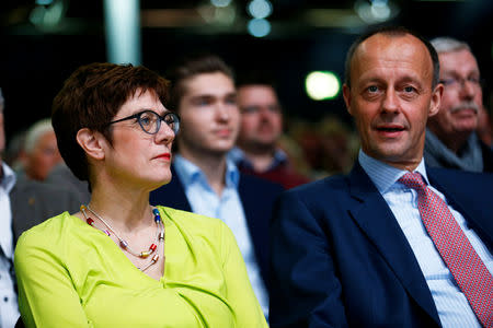 FILE PHOTO: Christian Democratic Union (CDU) candidates for the party chair Annegret Kramp-Karrenbauer and Friedrich Merz attend a regional conference in Duesseldorf, Germany, November 28, 2018. REUTERS/Thilo Schmuelgen/File Photo