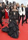 <p>Emily donned a lace jumpsuit with a ruffled train created by ex Roberto Cavalli creative director, Peter Dundas.<br><i>[Photo: AP]</i> </p>