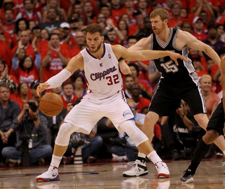 Blake Griffin #32 of the Los Angeles Clippers catches a pass in front of Matt Bonner #15 of the San Antonio Spurs in Game Three of the Western Conference Semifinals in the 2012 NBA Playoffs on May 19, 2011 at Staples Center in Los Angeles, California. NOTE TO USER: User expressly acknowledges and agrees that, by downloading and or using this photograph, User is consenting to the terms and conditions of the Getty Images License Agreement. (Photo by Stephen Dunn/Getty Images)