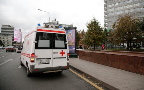 An ambulance leaves the Ekho Moskvy (Echo of Moscow) radio station office in Moscow, Russia - Credit: AP Photo/Alexander Zemlianichenko