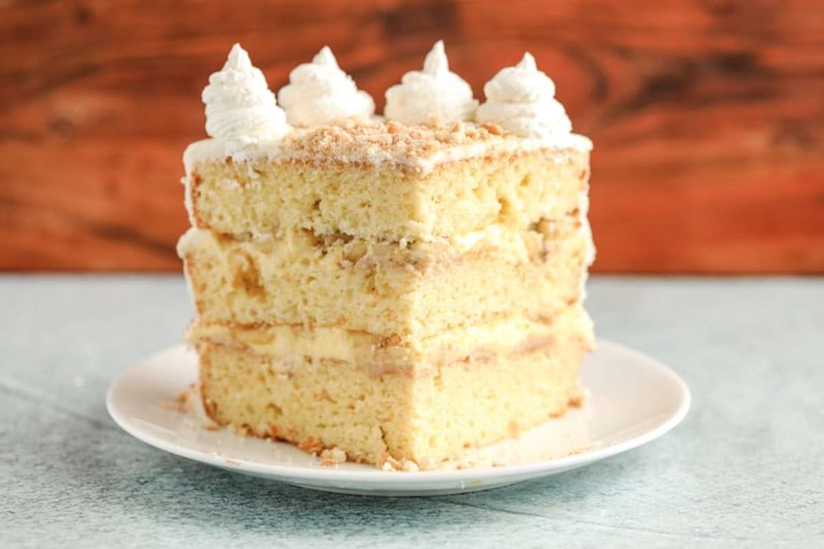 <p>This Banana Pudding Cake Recipe pairs layers of banana cake with a creamy pudding that is all topped off with a fluffy whipped frosting, perfect for Mother's Day.</p><p><strong>Get the recipe: <a href="https://recipesfromapantry.com/banana-pudding-cake-recipe-southern/" rel="nofollow noopener" target="_blank" data-ylk="slk:Banana Pudding Cake;elm:context_link;itc:0;sec:content-canvas" class="link rapid-noclick-resp">Banana Pudding Cake</a></strong></p>