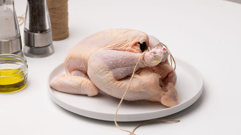 chicken being tied with twine