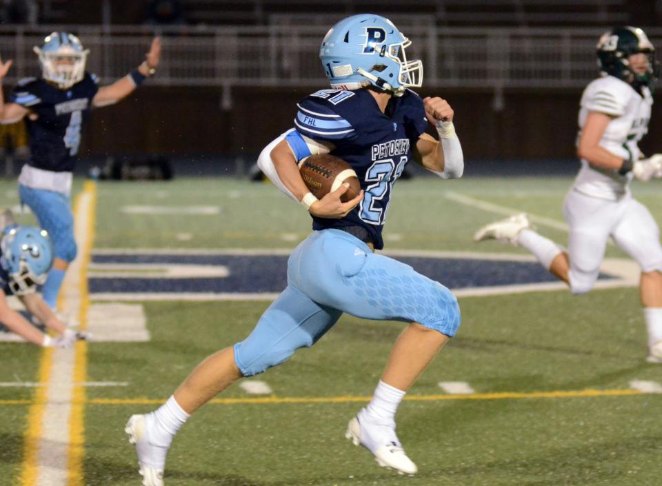 Petoskey running back Brendan Swiss takes off down the sidelines on a lengthy run against Alpena Friday night.