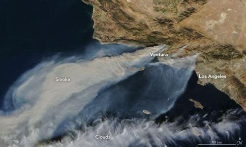 Nasa satellite footage captured on 5 December shows thick smoke streaming from several fires in southern California.