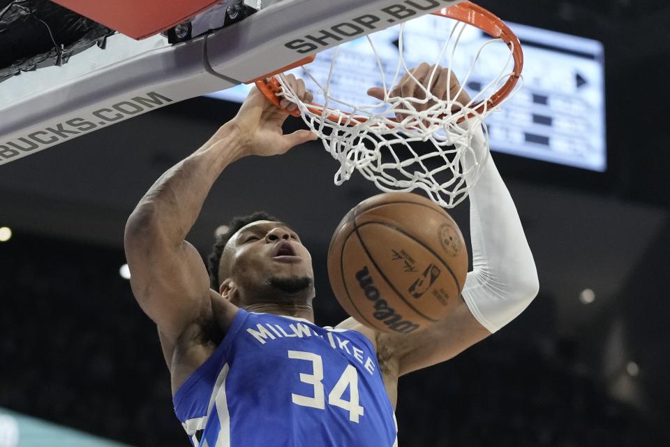 Milwaukee Bucks' Giannis Antetokounmpo dunks during the second half of an NBA basketball game against the San Antonio Spurs Wednesday, March 22, 2023, in Milwaukee. The Bucks won 130-94. (AP Photo/Morry Gash)