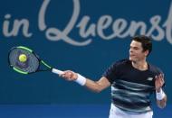 Tennis - Brisbane International - Pat Rafter Arena, Brisbane, Australia - 6/1/17 - Canada's Milos Raonic hits a shot during his match against Spain's Rafael Nadal. REUTERS/Steve Holland