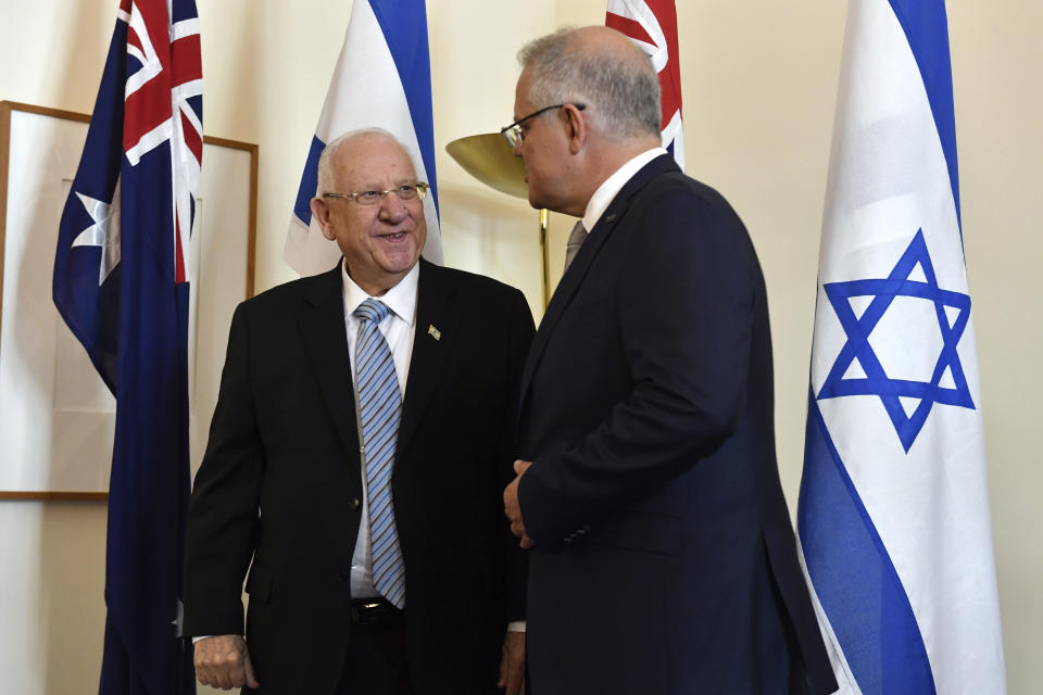 Israel's President Reuvin Rivlin, left, and Australia's Prime Minister Scott Morrison meet at Parliament House in Canberra, Wednesday, Feb. 26, 2020. Rivlin and Morrison discussed an extradition request for a former school principal whose alleged abuse of Australian school girls has cast a shadow over the Israeli leader's visit. (Mick Tsikas/AAP Image via AP)