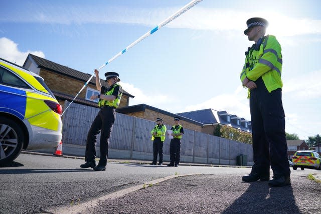 Police officers at the scene in Ashlyn Close, Bushey, Hertfordshire